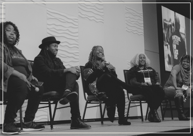 group of people discussing on stage