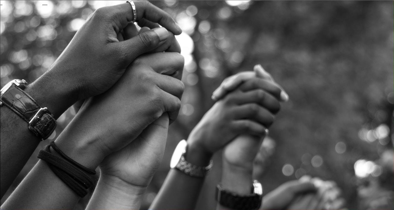 homepage banner image of people joining hands